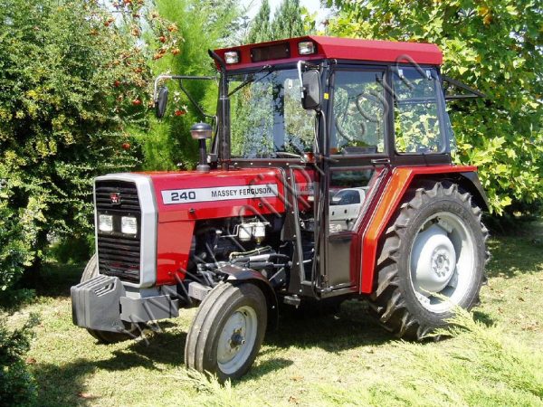 A Massey Ferguson Tractor MF-240, a 50hp 2WD model with a cabin, standing in a field.