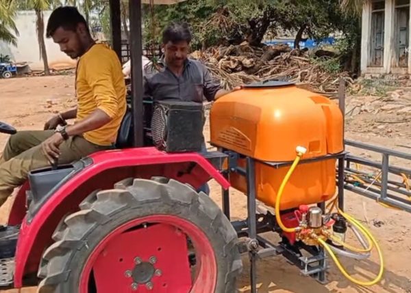 Image showing a Murshid Farm Industries Tractor Mounted Boom Sprayer attached to a tractor, ready for efficient field spraying, highlighting its robust design and extensive reach for optimal agricultural use.