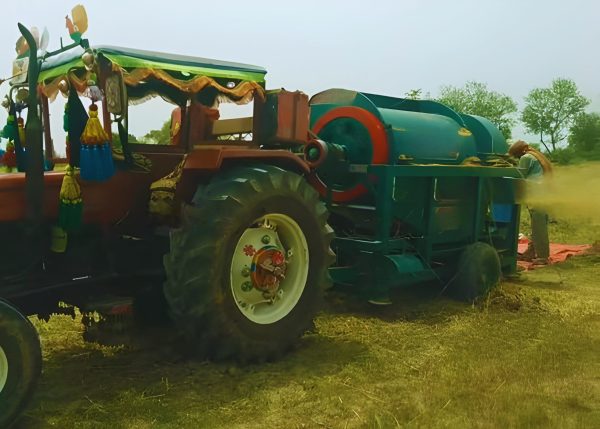 Murshid Farm Industries Implement Wheat Thresher in working position, left side view.