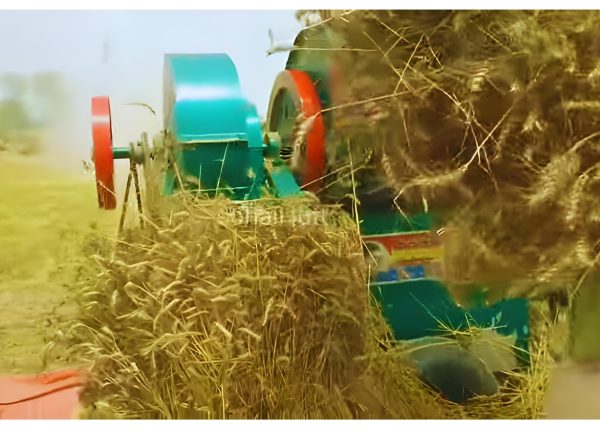 Close-up view of Murshid Farm Industries Implement Wheat Thresher in working position.
