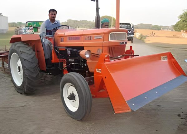 Murshid Farm Industries Implement HYDRAULIC FRONT BLADE attached with tractor, lifting position.