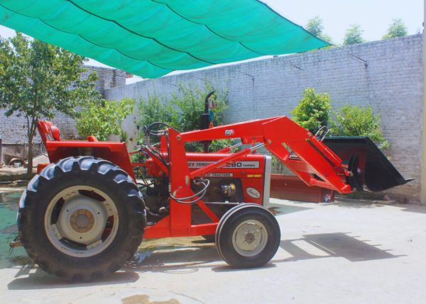 Murshid Farm Industries Implement HYDRAULIC FRONT END LOADER left side view, loaded position.