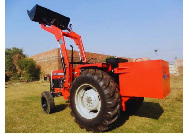 A Murshid Farm Industries Implement HYDRAULIC FRONT END LOADER attached to the back of a tractor, positioned for loading.