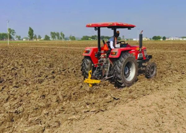 A Murshid Farm Industries Implement Sub Soiler at work in a farm field, breaking up soil.