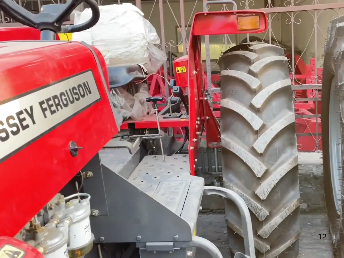 Massey Ferguson MF 360 Turbo 4WD 60HP tractor manufactured by Millat Tractors Pakistan, showing operator platform, control levers, and heavy-duty rear tyre