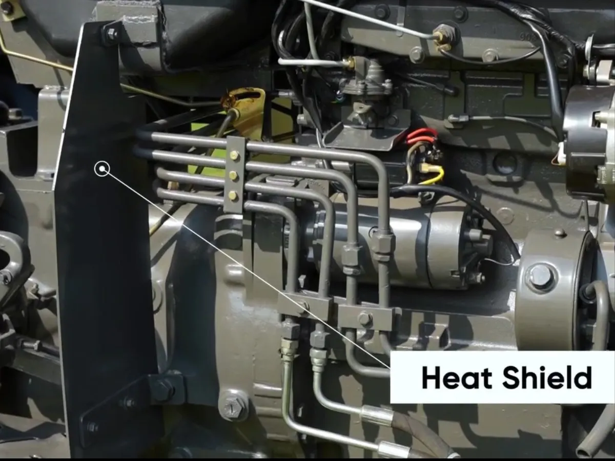 Close-up view of engine heat shield on Millat Massey Ferguson MF 260 Deluxe 2WD 60HP tractor protecting fuel lines