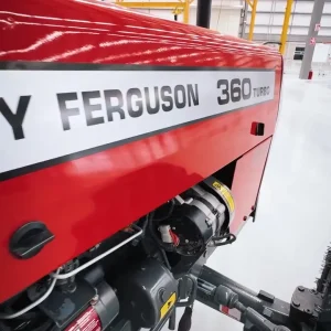 Millat Massey Ferguson MF 360 Turbo 4WD 60 HP tractor engine side view showing MF 360 branding inside factory