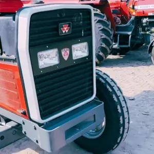 Massey Ferguson MF 385 Deluxe 2WD 85HP 2026 model front grille close up with headlights and logo