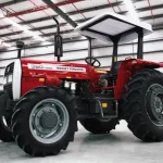 Millat Massey Ferguson MF 360 4WD 60 HP tractor left front angle showing full body, canopy and heavy-duty tyres inside factory