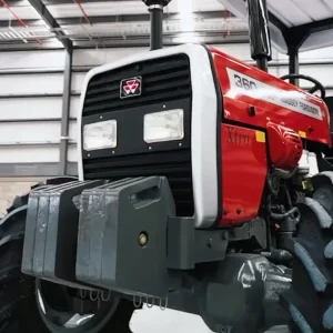Millat Massey Ferguson MF 360 4WD 60 HP tractor front left angle showing grille, headlights, front weight block and canopy inside factory