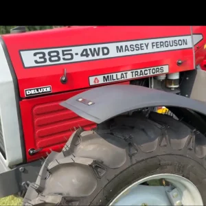 Side view of Millat Massey Ferguson MF 385 Deluxe 4WD 85 HP 2026 model showing bonnet branding and front tyre