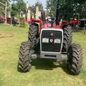 Massey Ferguson MF 360 4WD 60HP tractor front view parked on green garden lawn