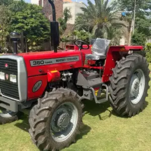 Massey Ferguson MF 360 4WD 60HP tractor parked on green garden lawn side front view