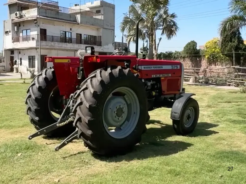 Rear view of a red MF 375 2WD showing its tyres and three-point linkage