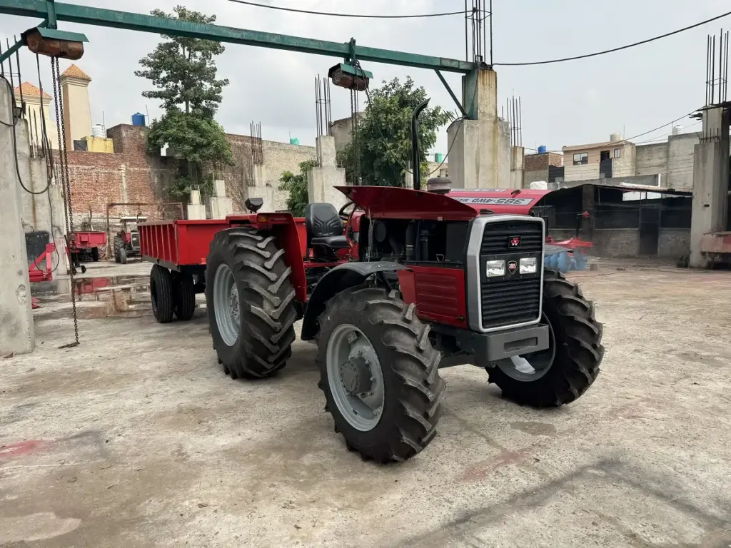 MF 385 4WD with a trailer Front three-quarter view of an MF 385 4WD attached to a red trailer